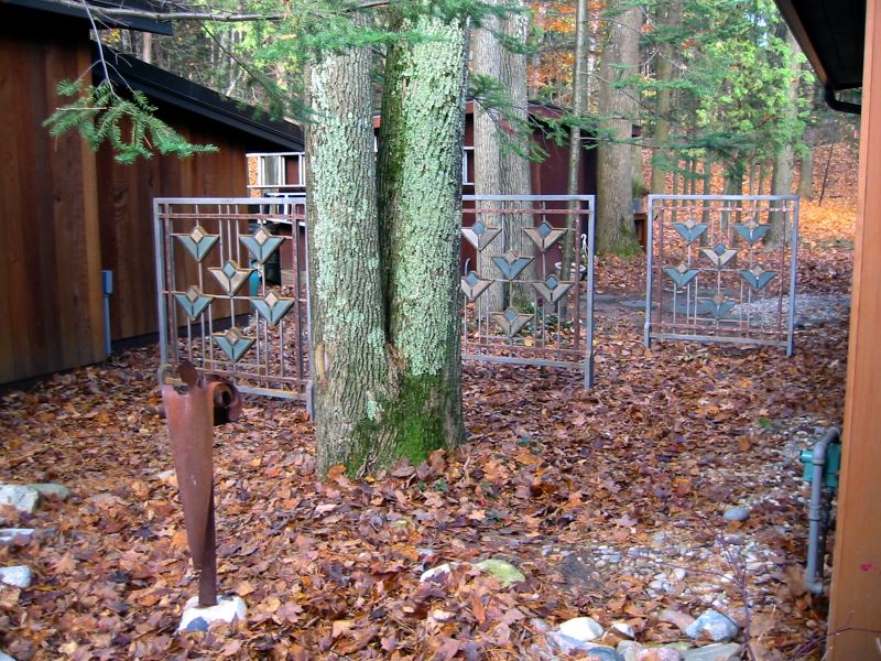 Frank Lloyd Wright Styled Fence in Steel, Slate, Copper + Glass