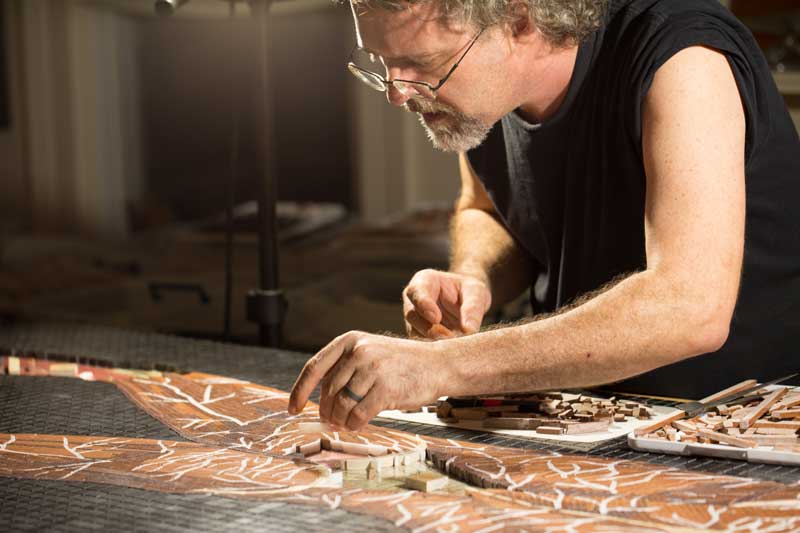 John T. Unger at work on marble mosaic