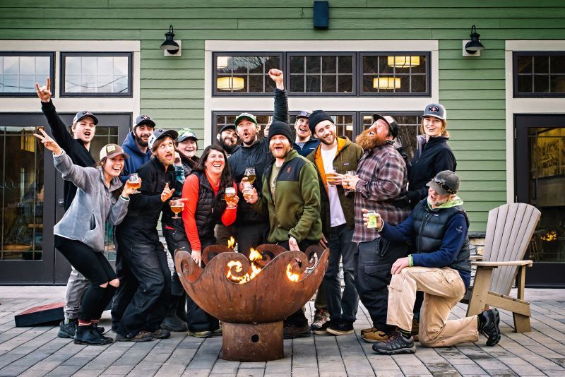 The staff gathers around a 41 inch Waves O' Fire Sculptural Firebowl at Lawsons Finest Brewery and Taproom, Waitsfield, VT
