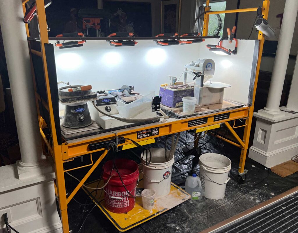 Lapidary workstation with wet saw and grinding machines used for Anatomy Set in Stone