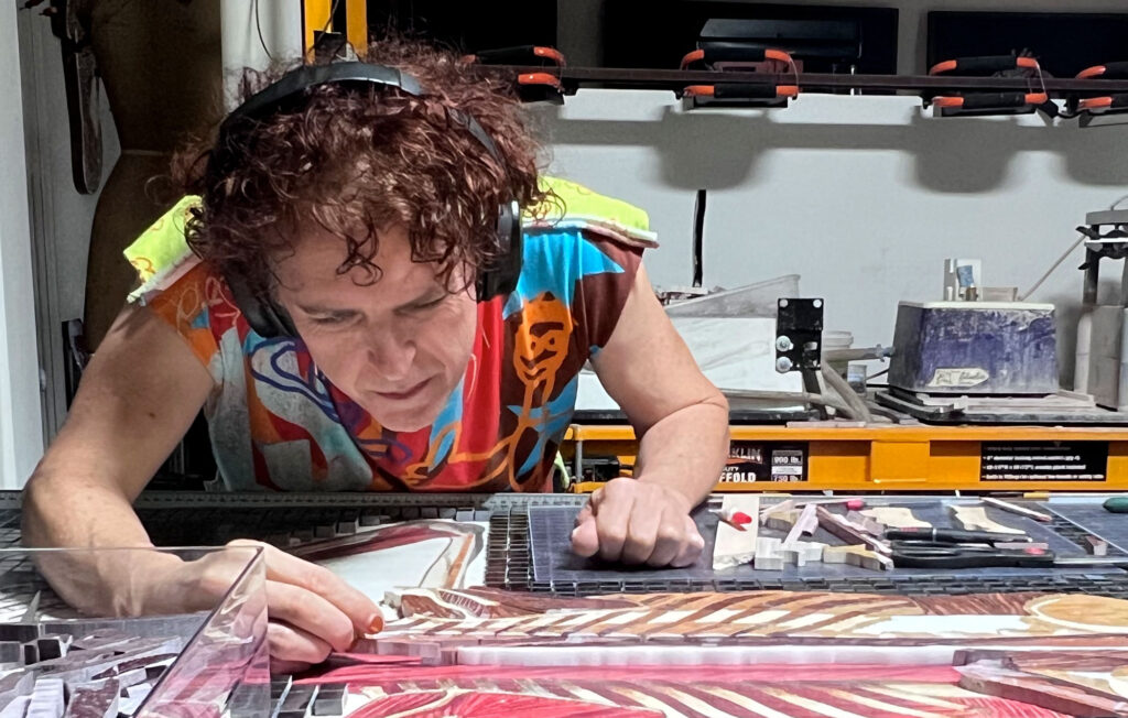 Rachael Que Vargas cutting and setting stone for Anatomy Set in Stone