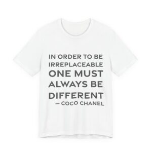 'In Order to Be Irreplaceable' — Coco Chanel Quote Tee | RQuéV Black-on-White Statement Shirt — Classic Tee